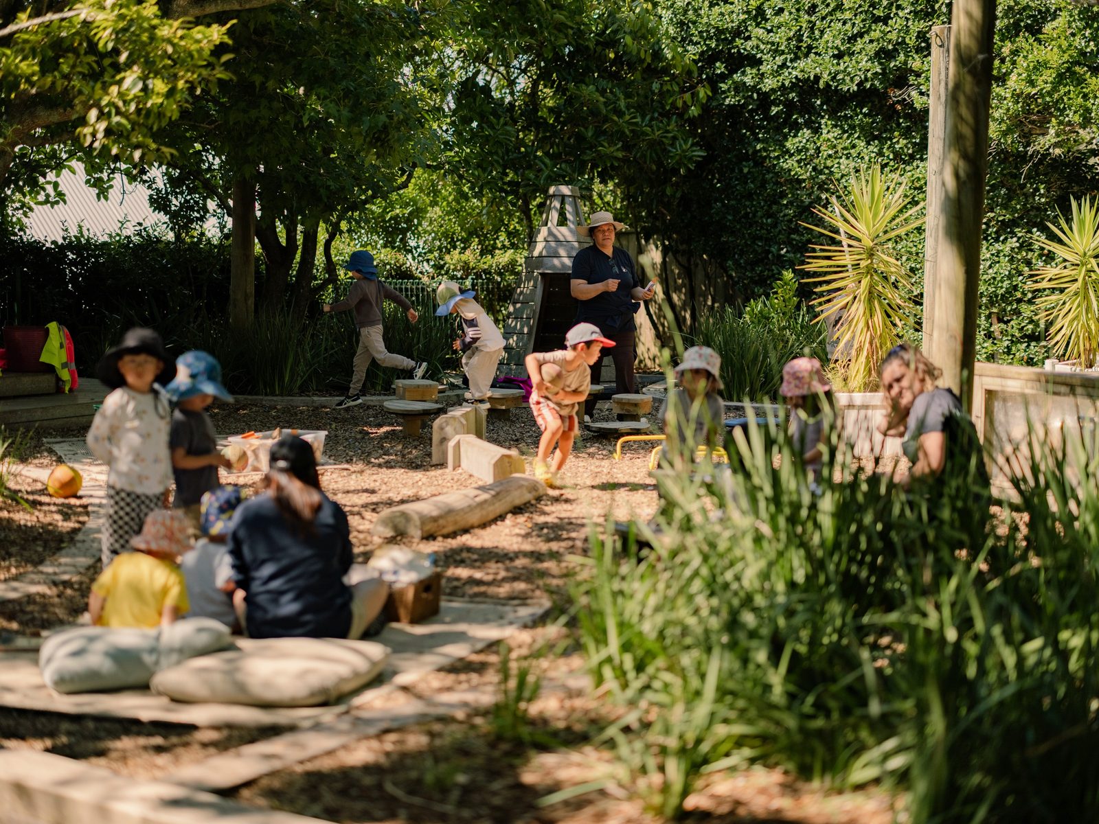 Children and teachers together across the Bear Park Epsom garden
